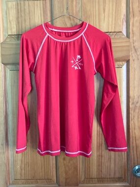 Boy’s size 12/14 Quad Seven long sleeved red swim shirt/rash guard